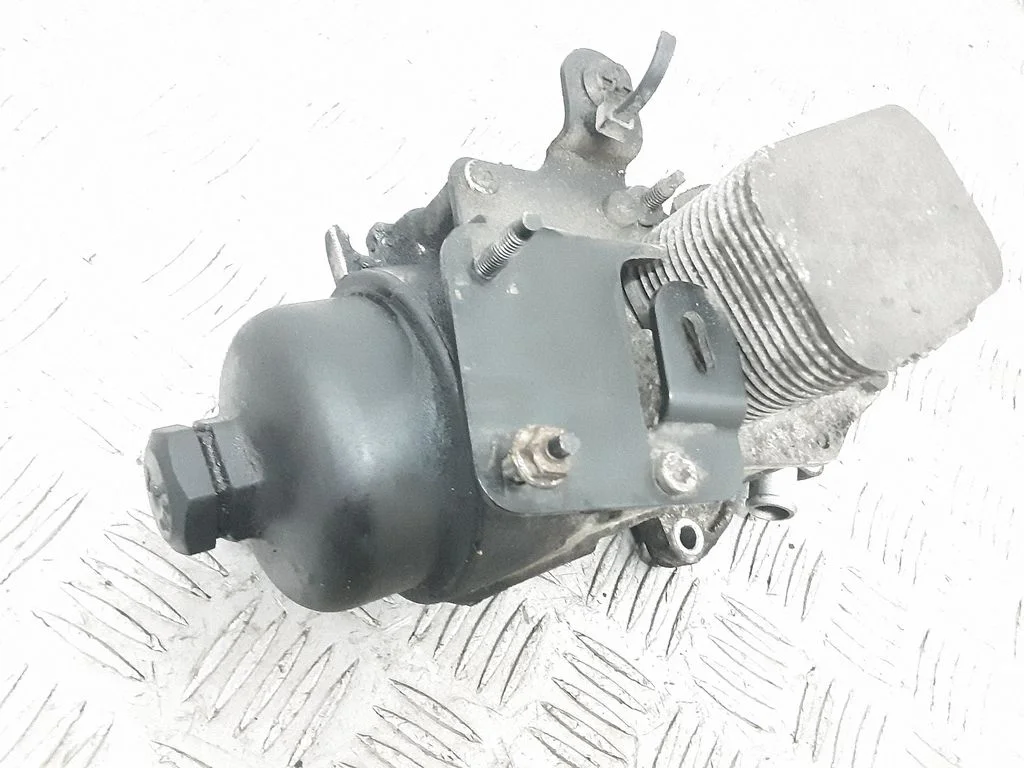 Oil filter mounting bracket – front