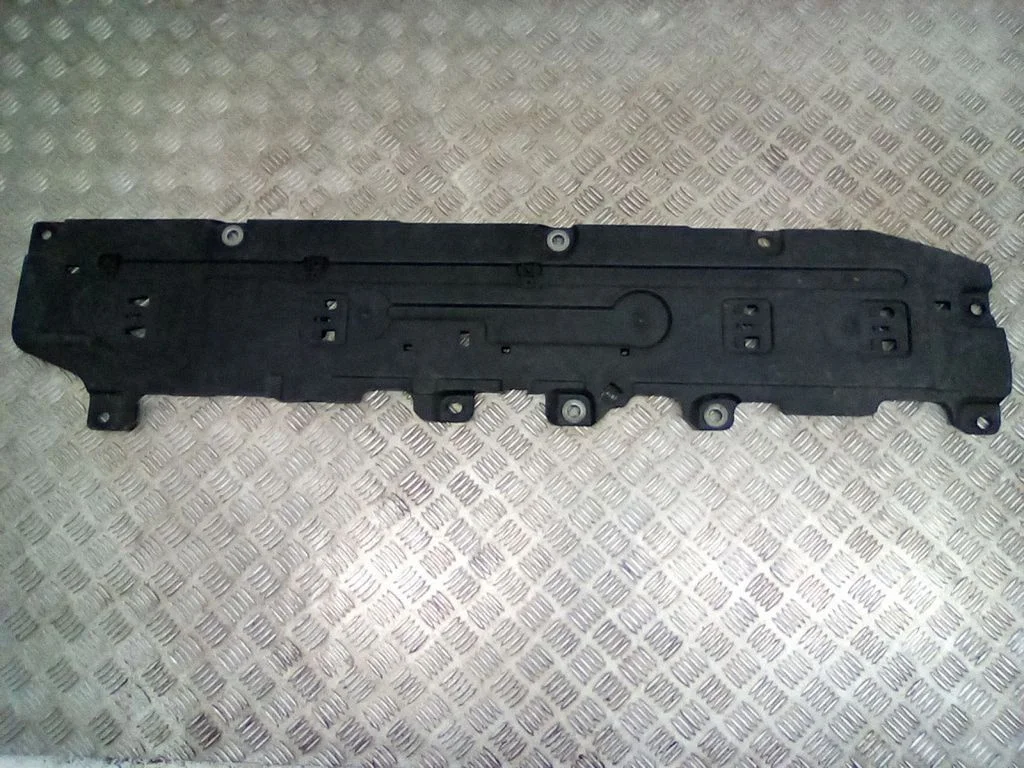 Center/middle under tray cover – right