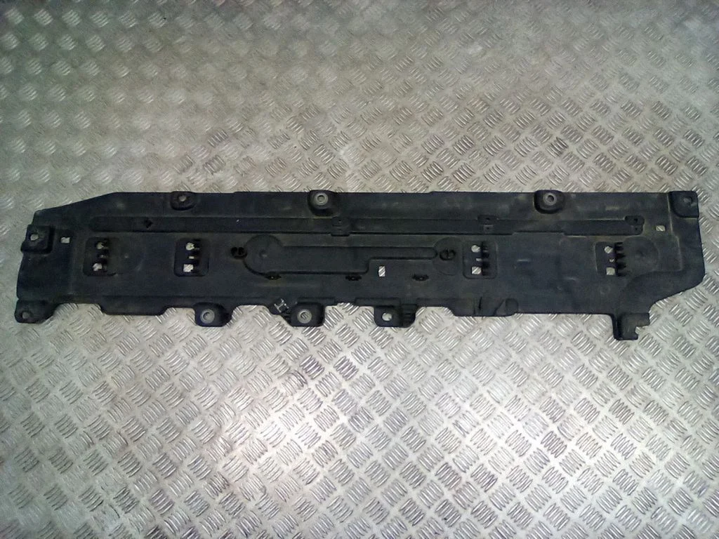 Center/middle under tray cover – right