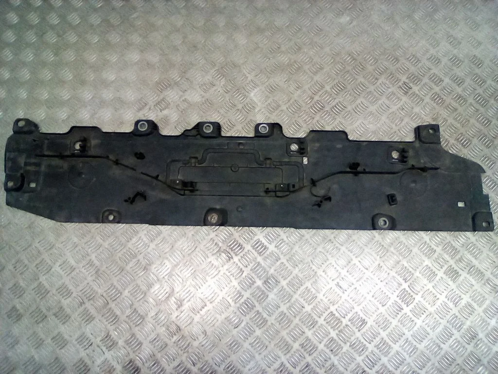 Center/middle under tray cover – left