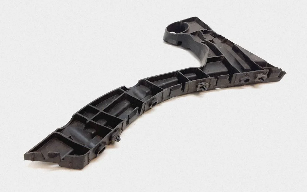 Rear bumper mounting bracket 30764697