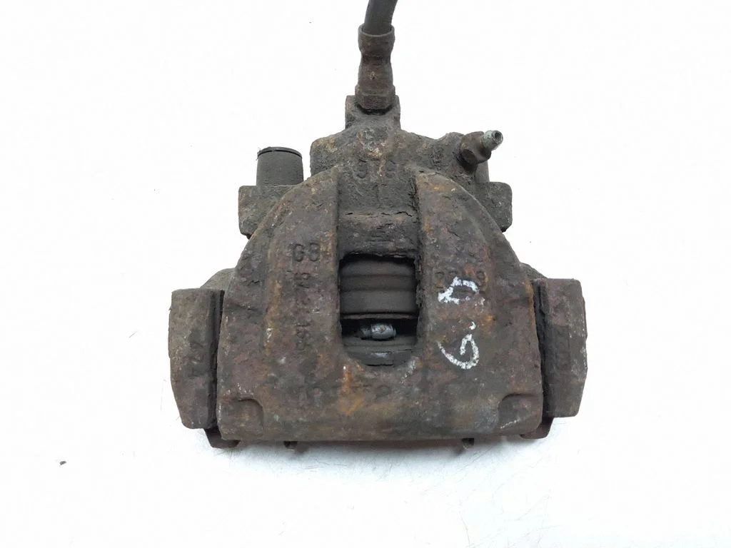 Rear brake caliper – left