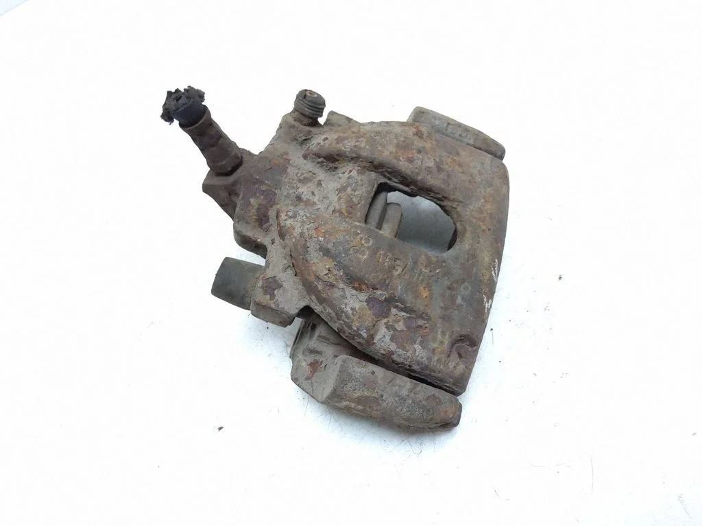 Rear brake caliper – left