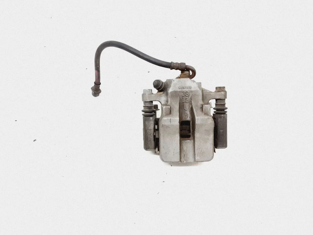 Rear brake caliper – left