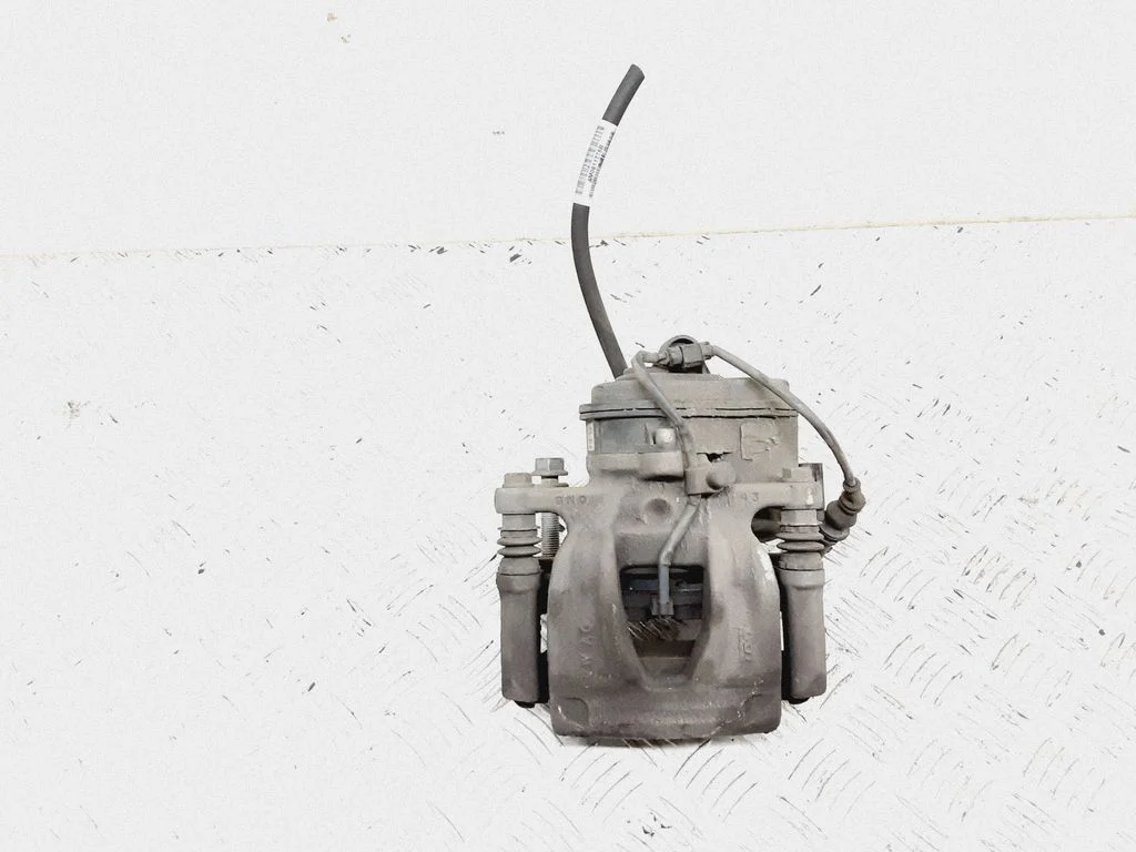 Rear brake caliper – left