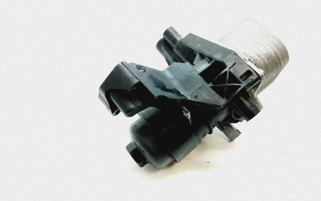 Oil filter mounting bracket 03N117021