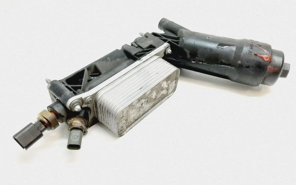 Oil filter mounting bracket 05184294AE