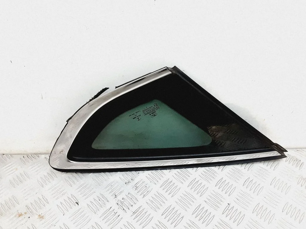 Rear side window – left