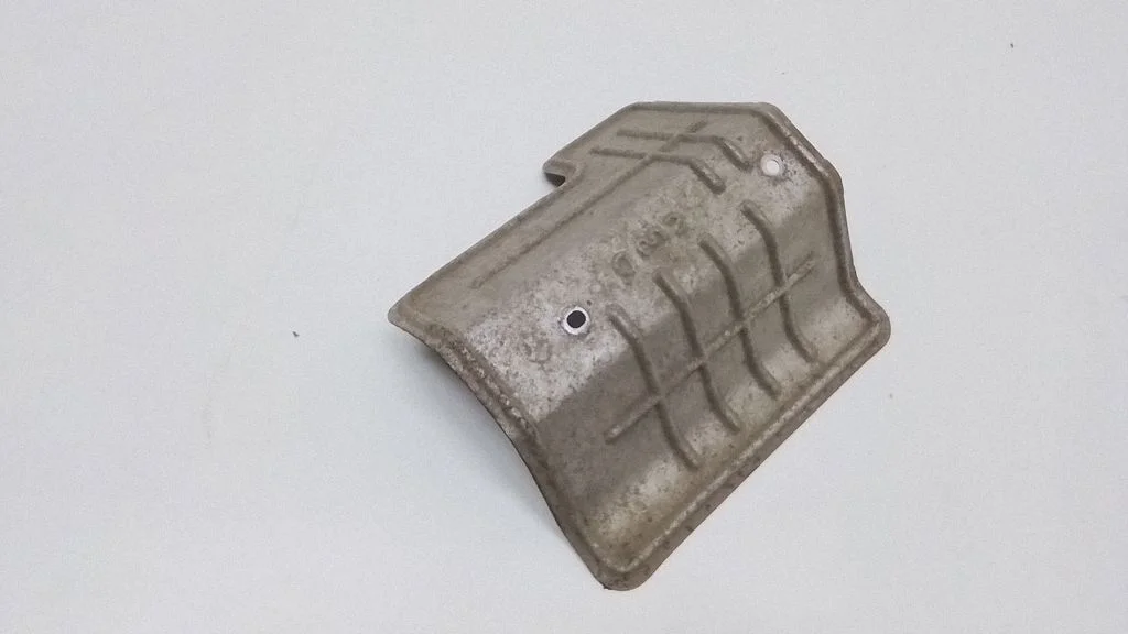 Exhaust heat shield – front