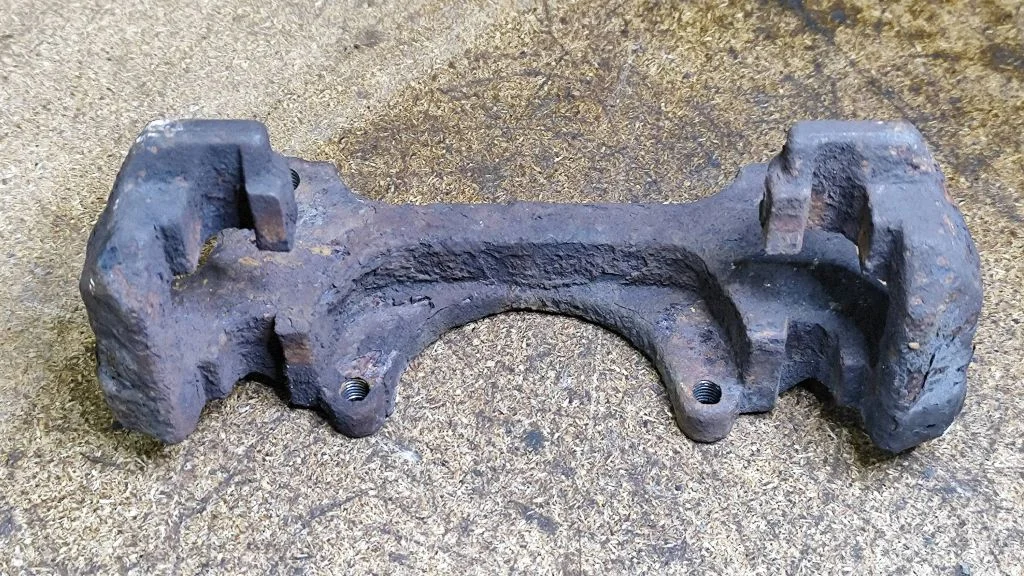 Front Brake Caliper Pad/Carrier