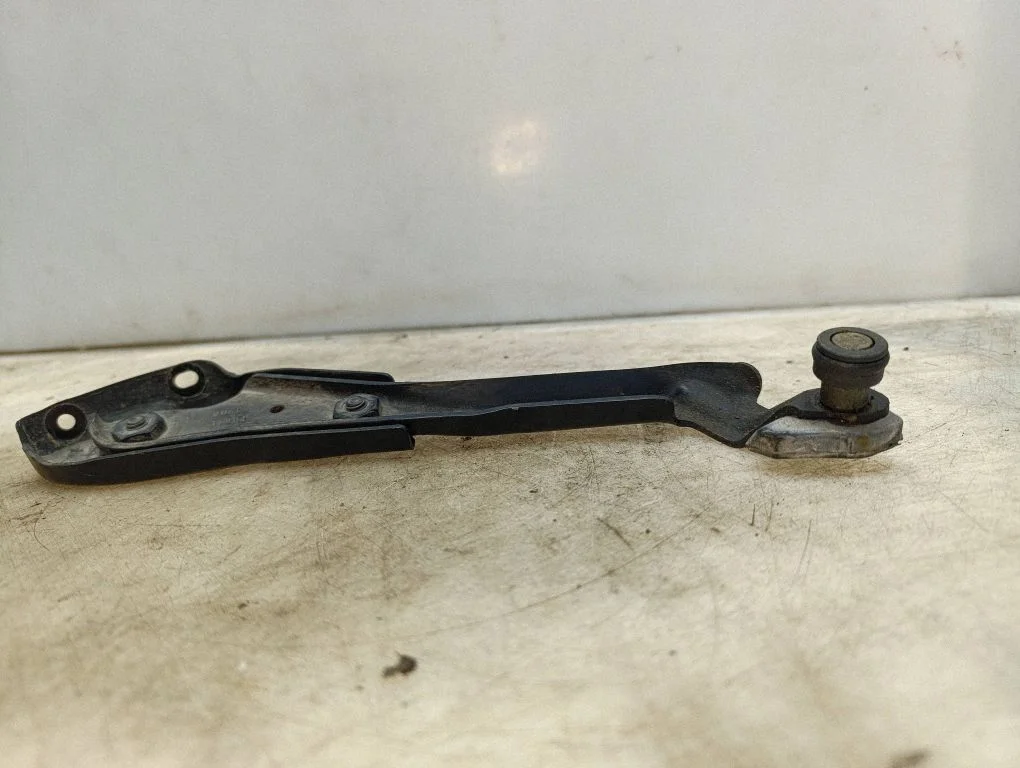 Sliding door check strap stopper