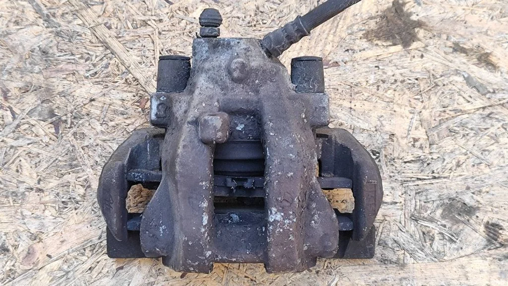 Rear brake caliper – left