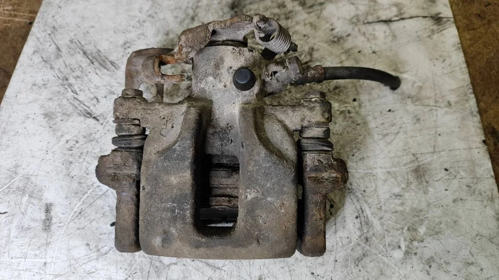 Rear brake caliper – right