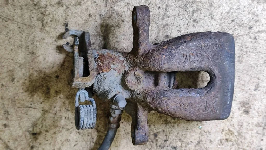 Rear brake caliper – left