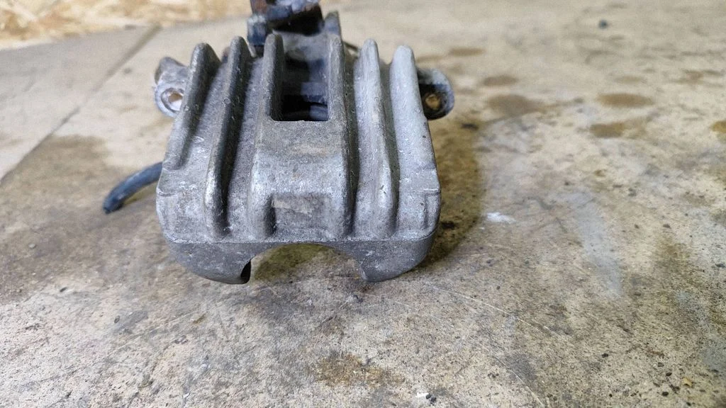 Rear brake caliper – left