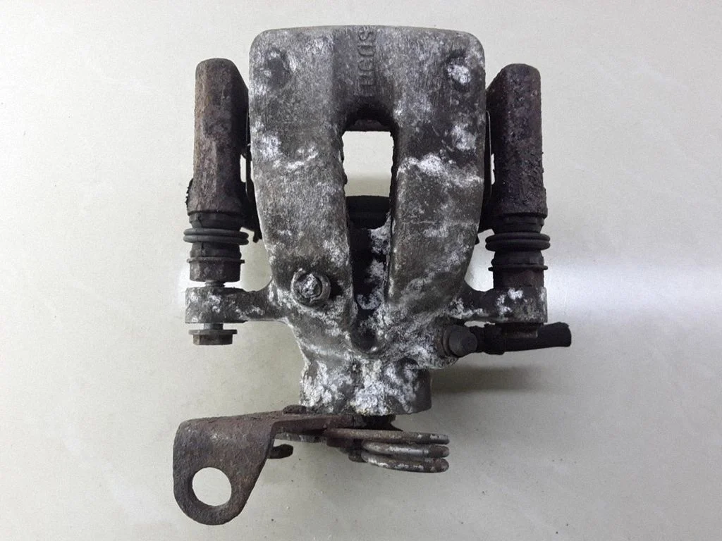 Rear brake caliper – right