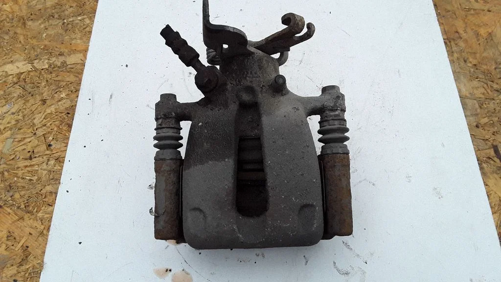 Rear brake caliper – left