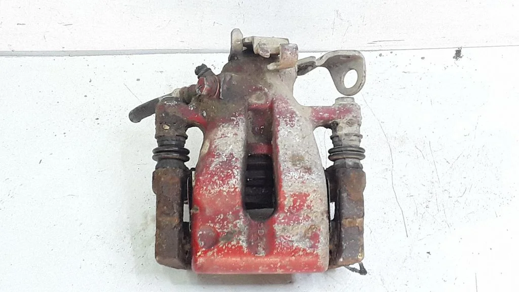 Rear brake caliper – left