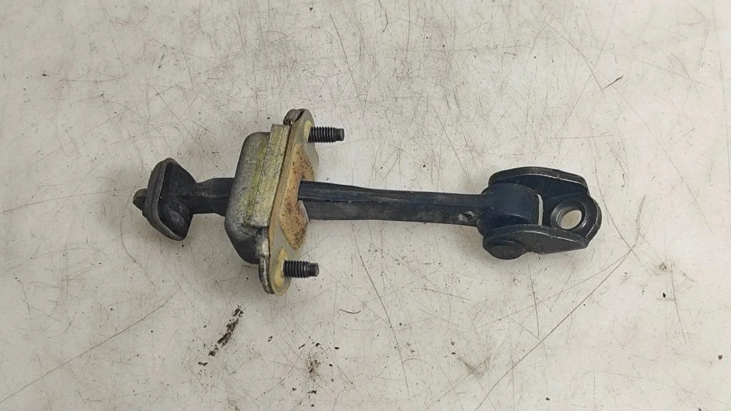 Rear door check strap stopper