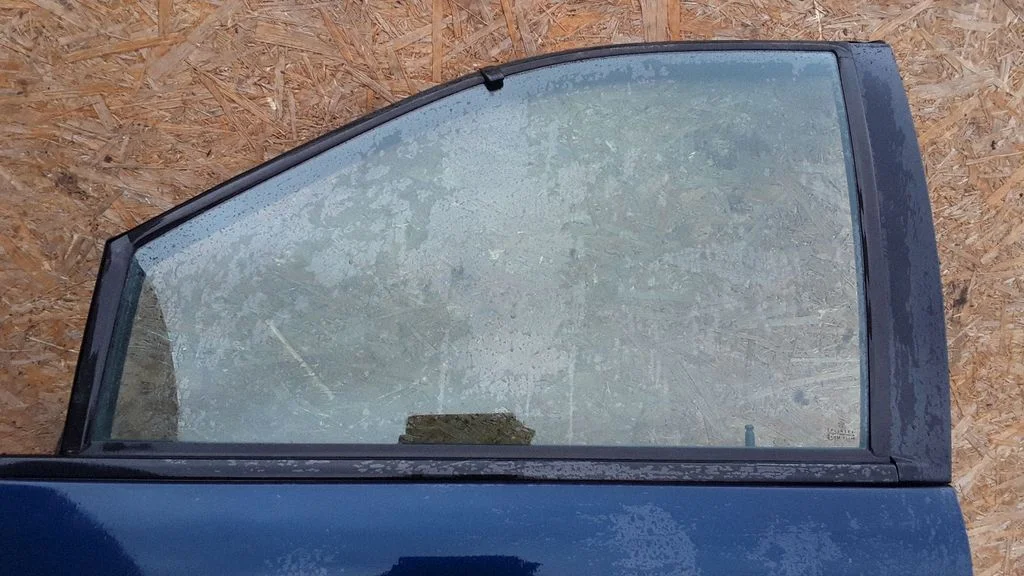 Front door window glass four-door – left