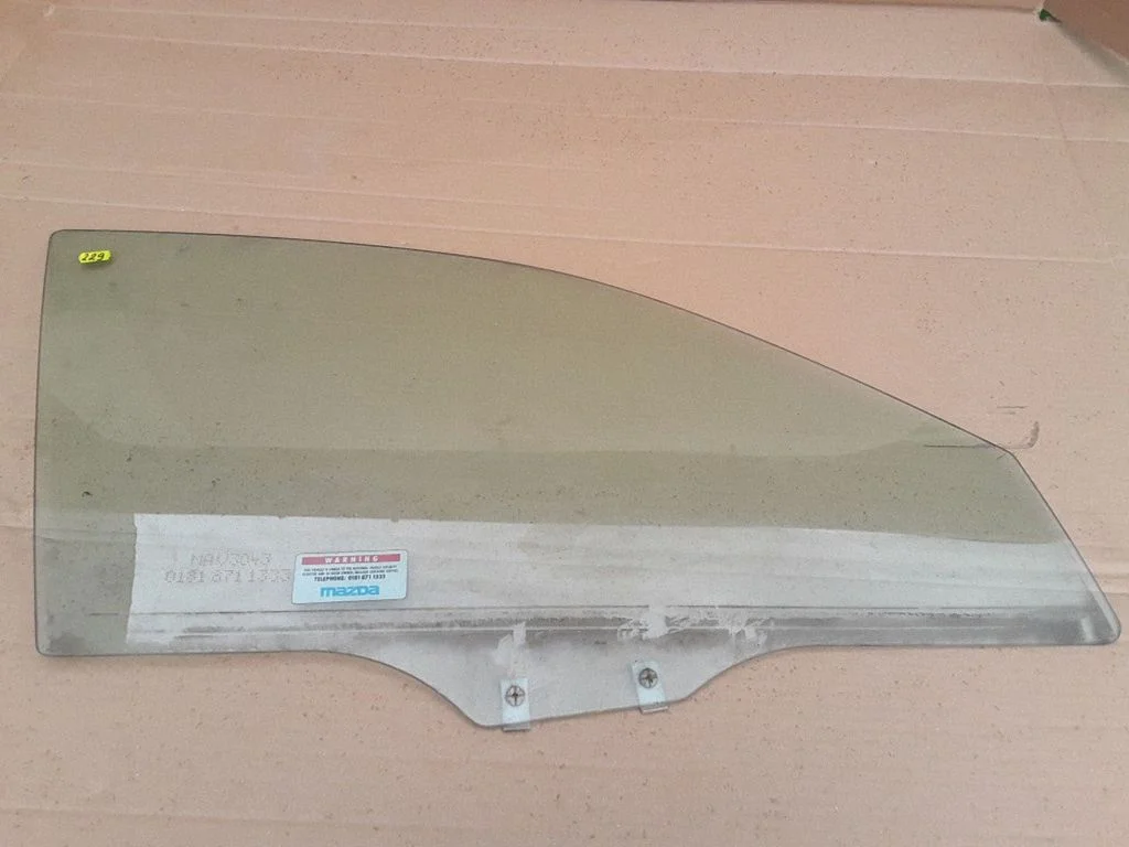 Front door window glass four-door – Mazda 626 (1998-2002)