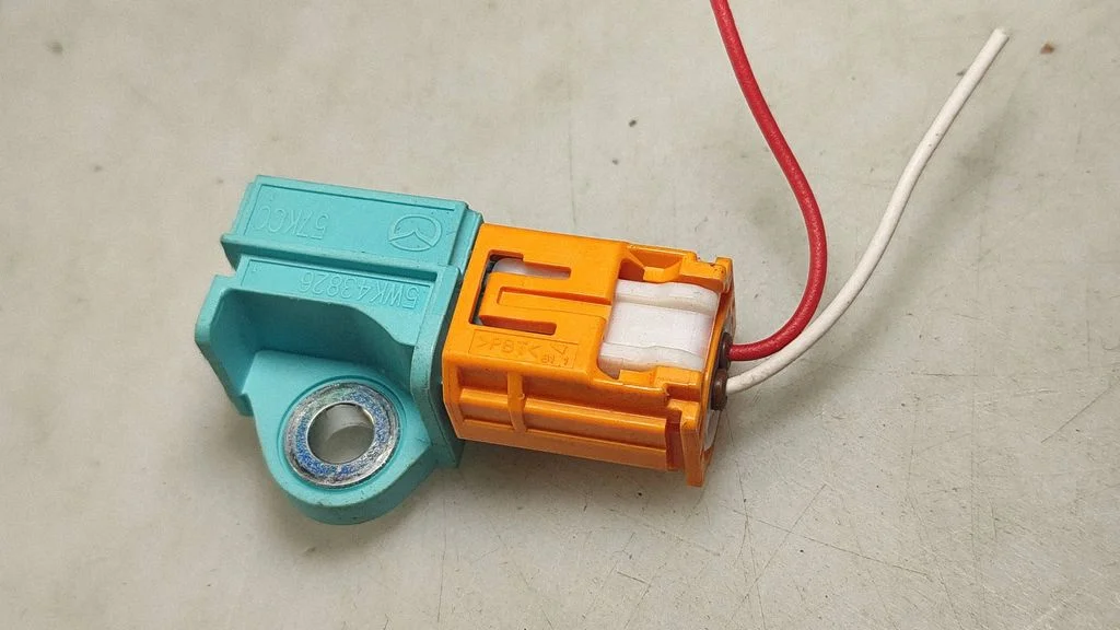 Airbag deployment crash/impact sensor 5WK43826