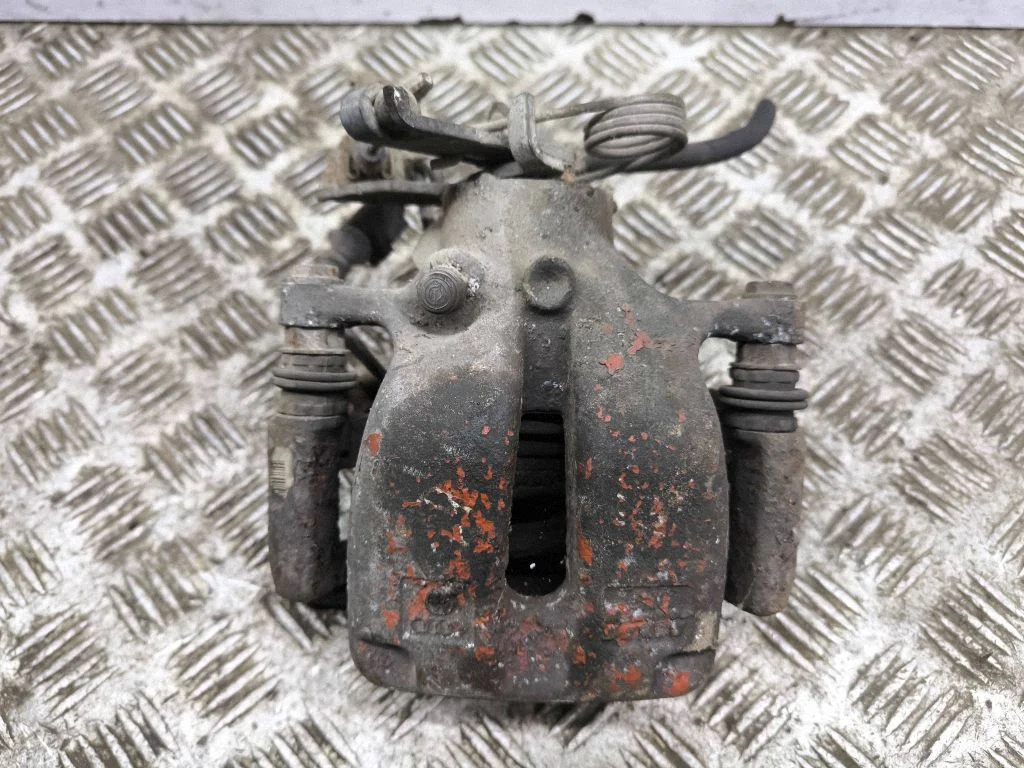 Rear brake caliper – left