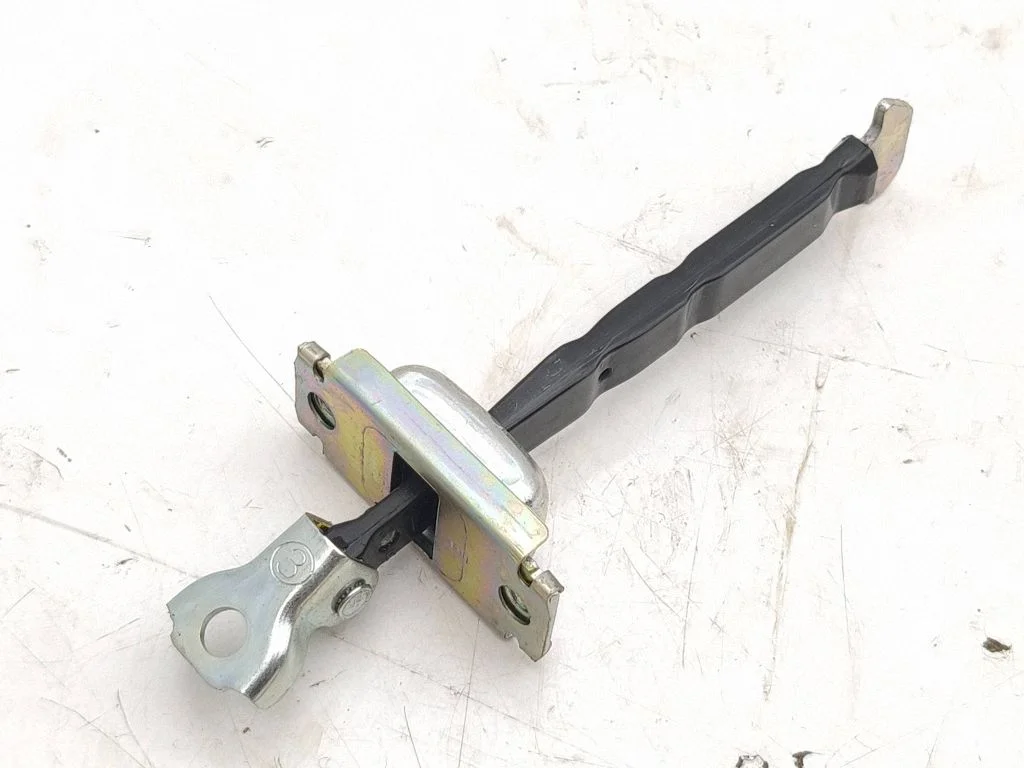 Front door check strap stopper – left