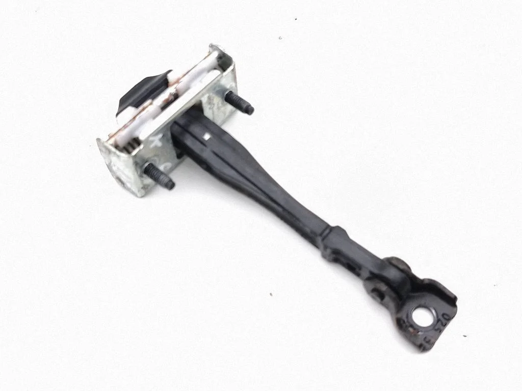 Rear door check strap stopper – left