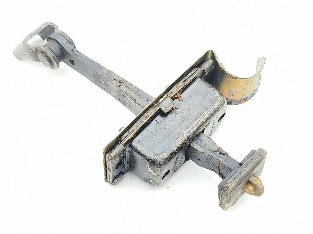 Front door check strap stopper – left