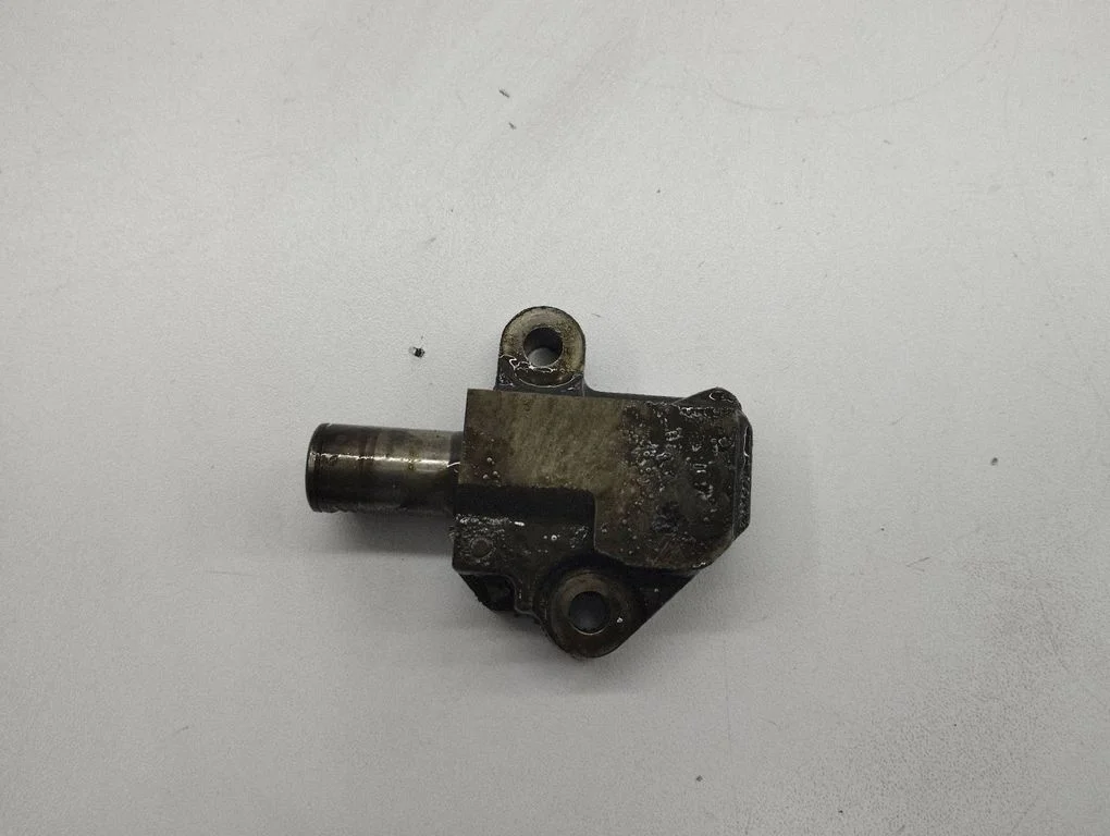 Timing belt/chain tensioner