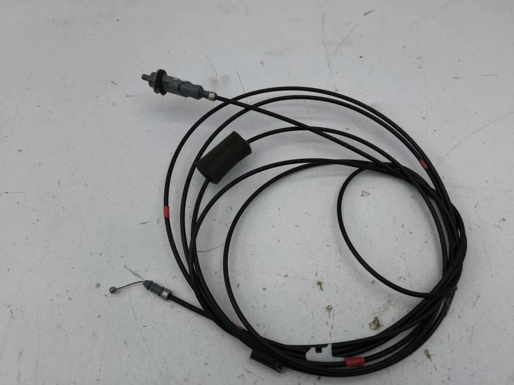 Fuel cap flap release cable