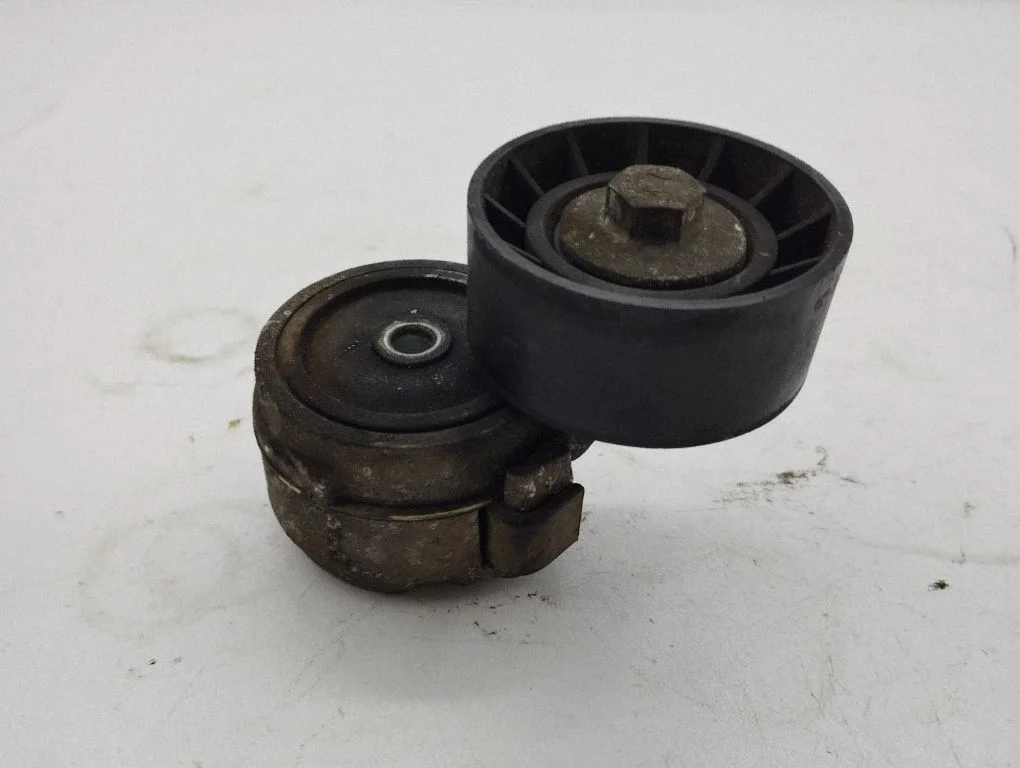 Alternator belt tensioner