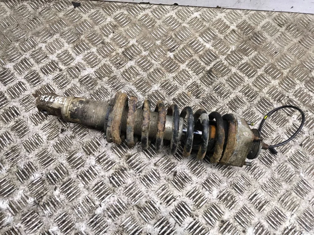 Front shock absorber with coil spring – left