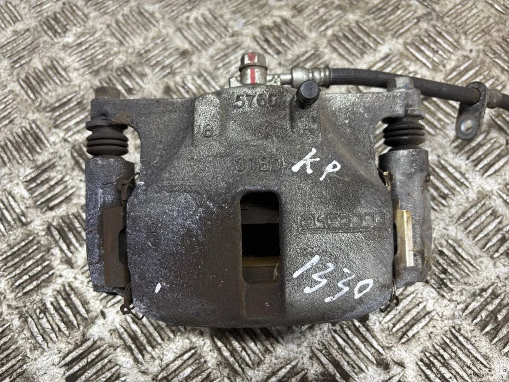 Front brake caliper – left