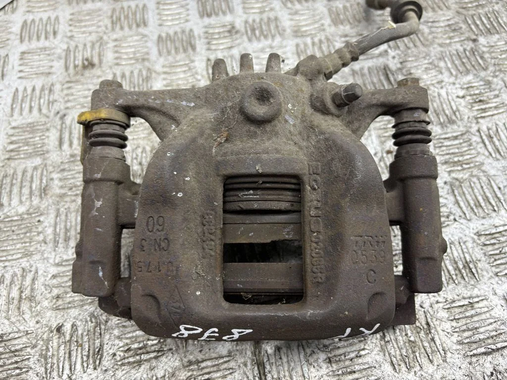 Front brake caliper – left