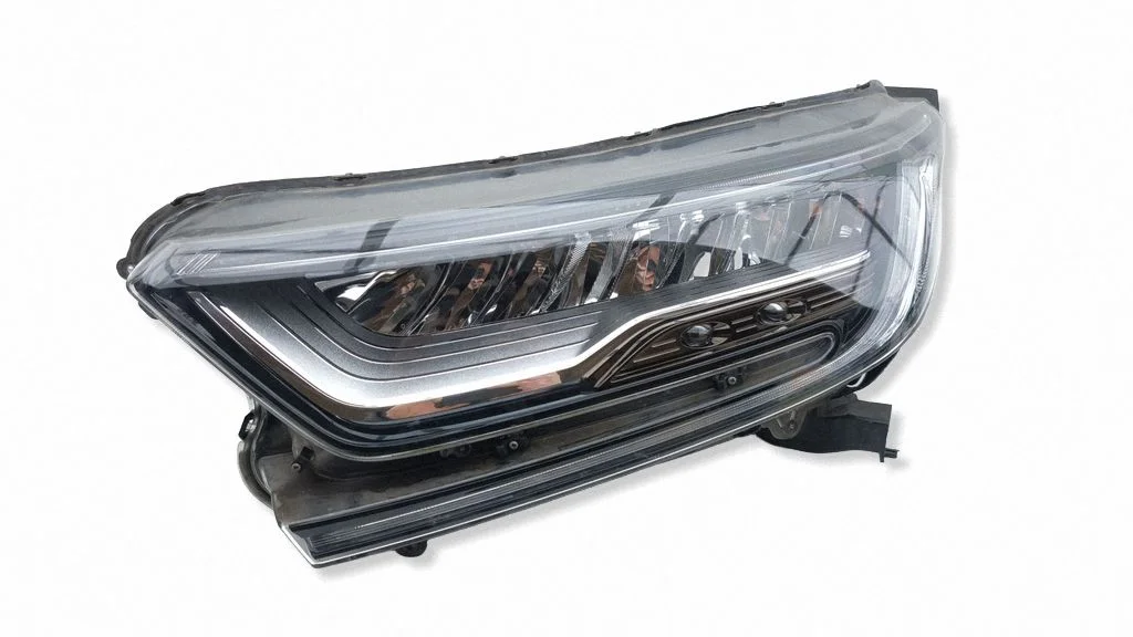 Headlight/headlamp – left