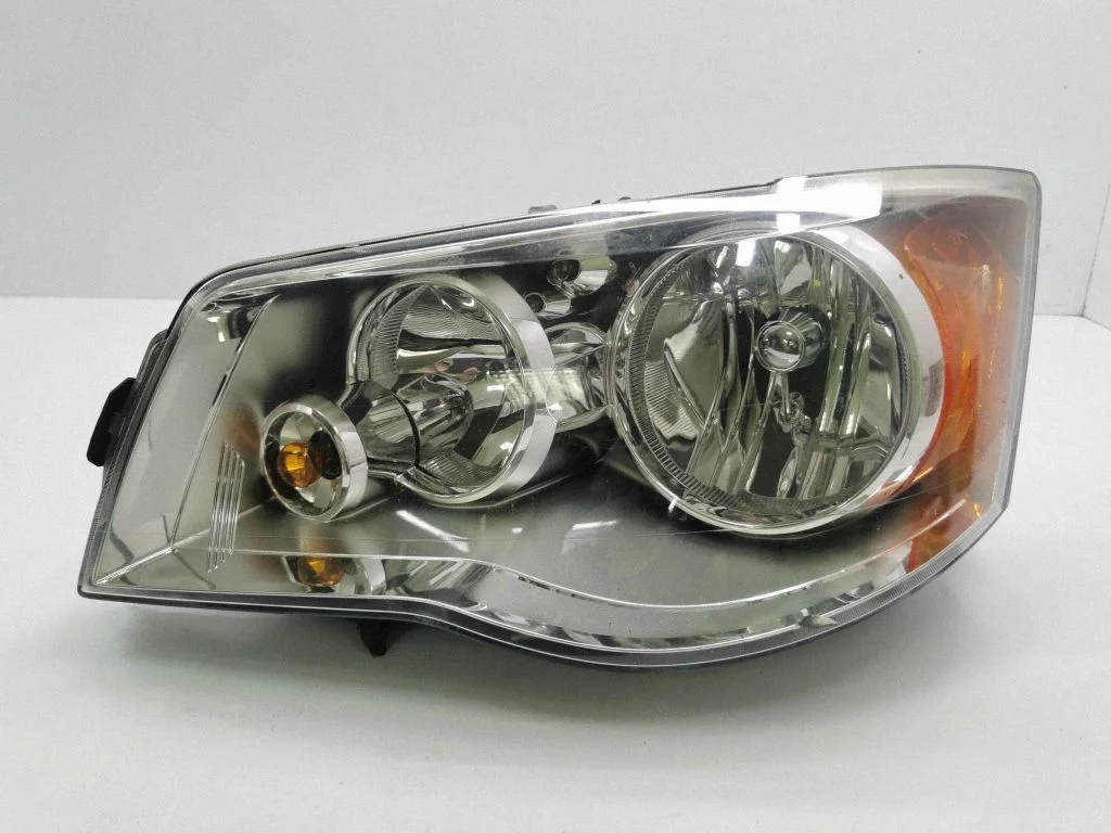Headlight/headlamp – left