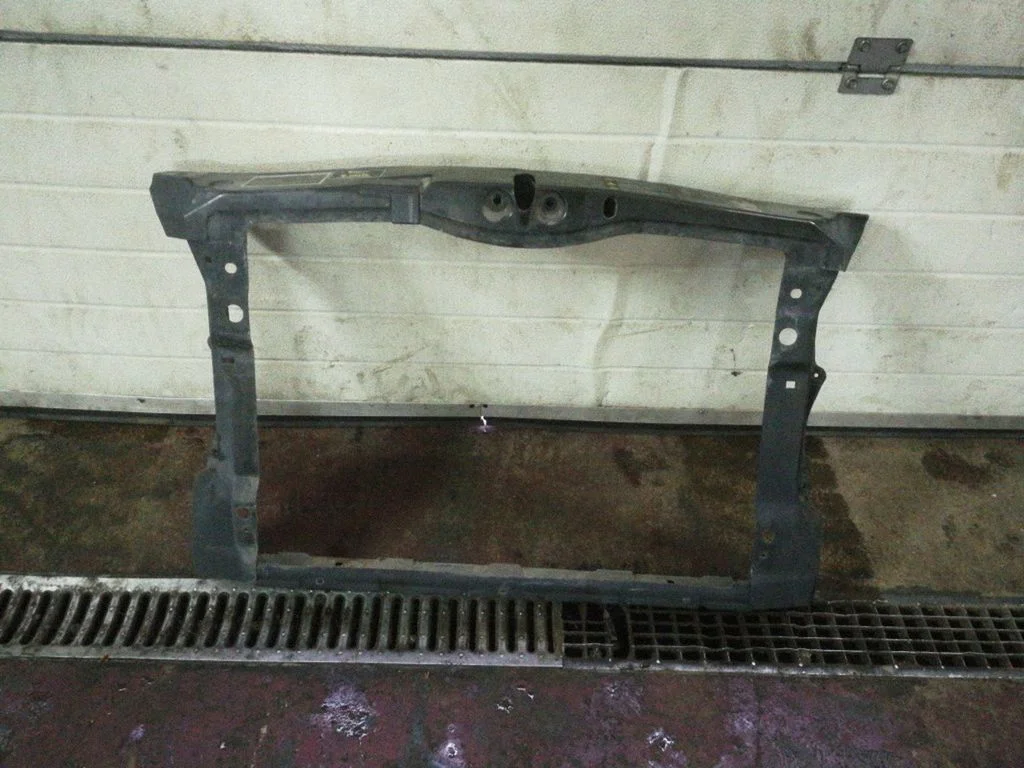 Radiator support slam panel