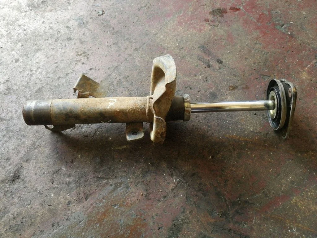 Front shock absorber/damper – left
