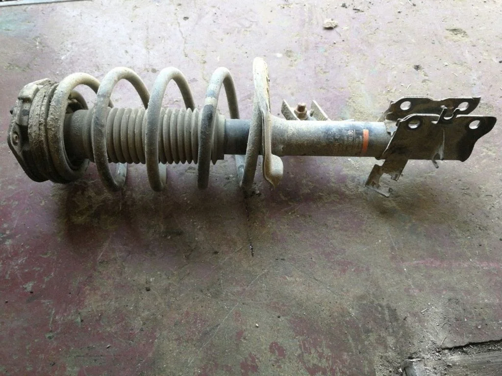 Front shock absorber/damper – left
