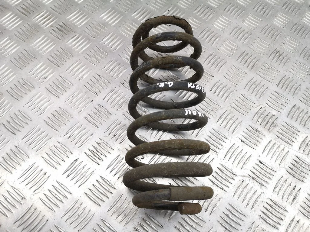 Rear coil spring – left