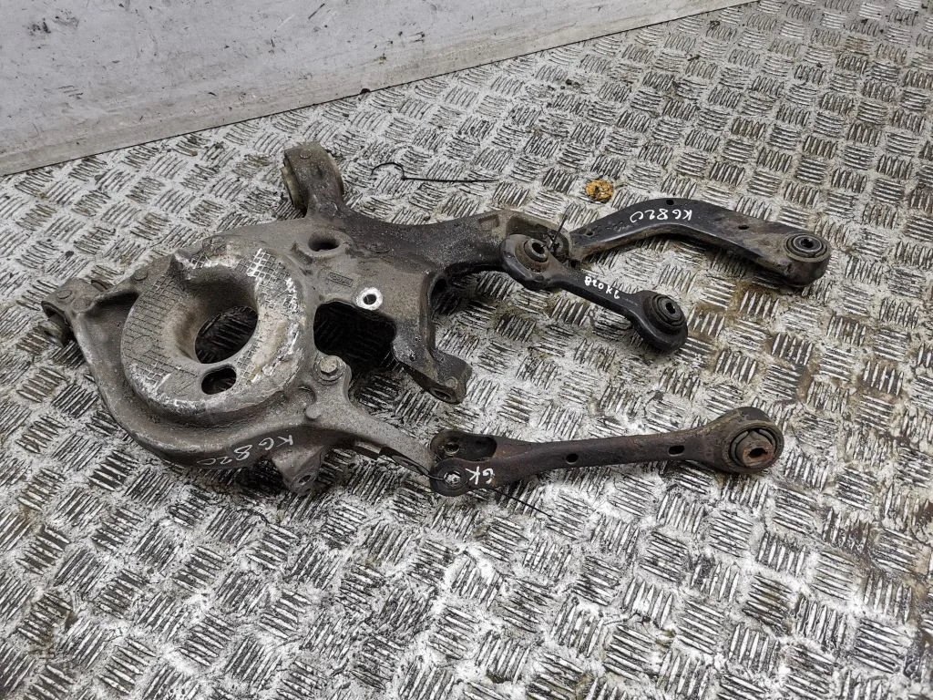 Rear upper control arm/wishbone – left