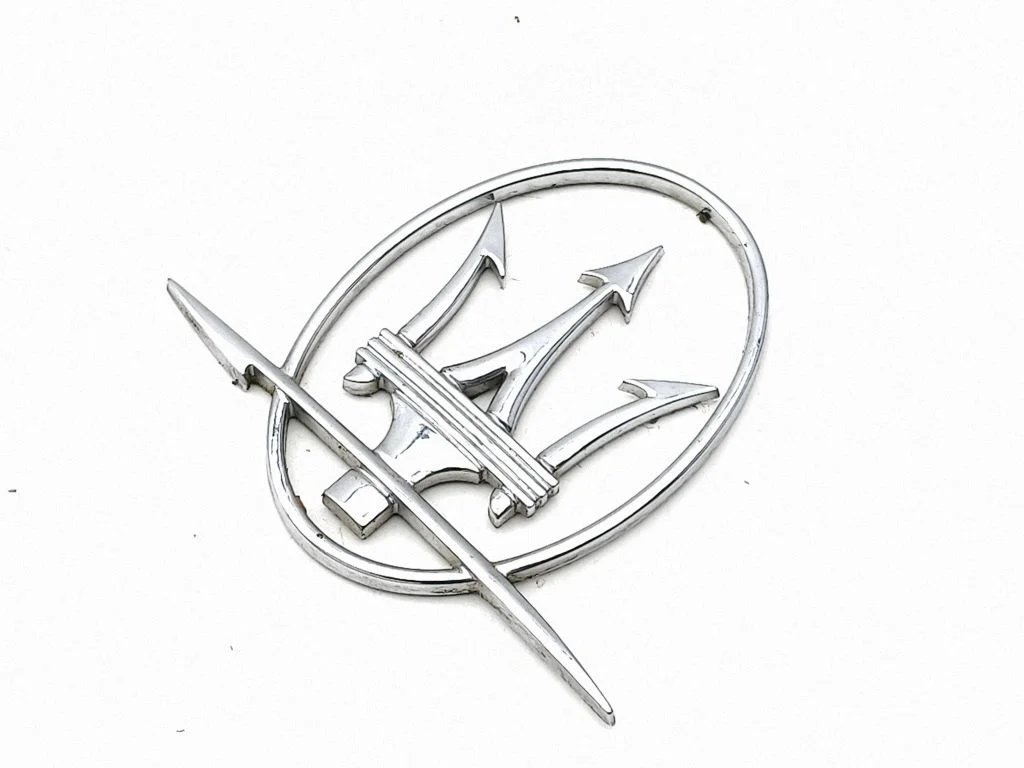 Manufacturer badge logo/emblem – left
