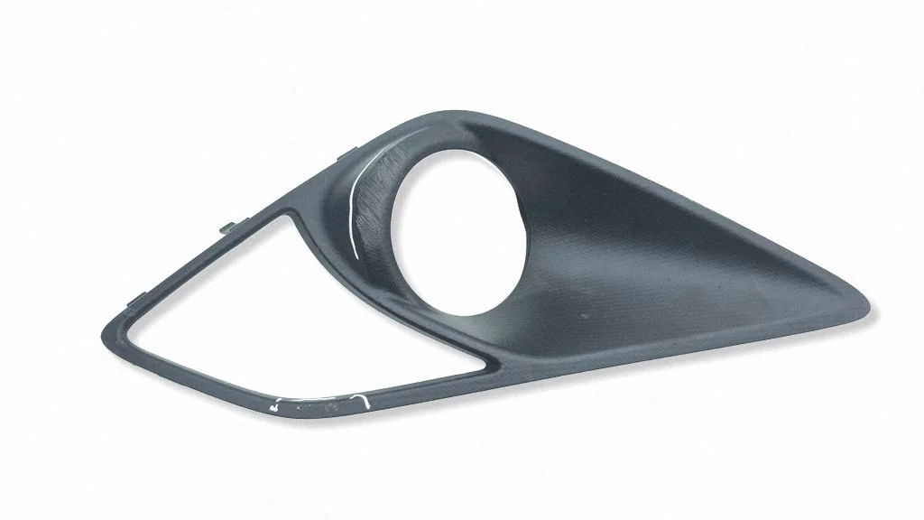 Front fog light trim/grill 57731CA030