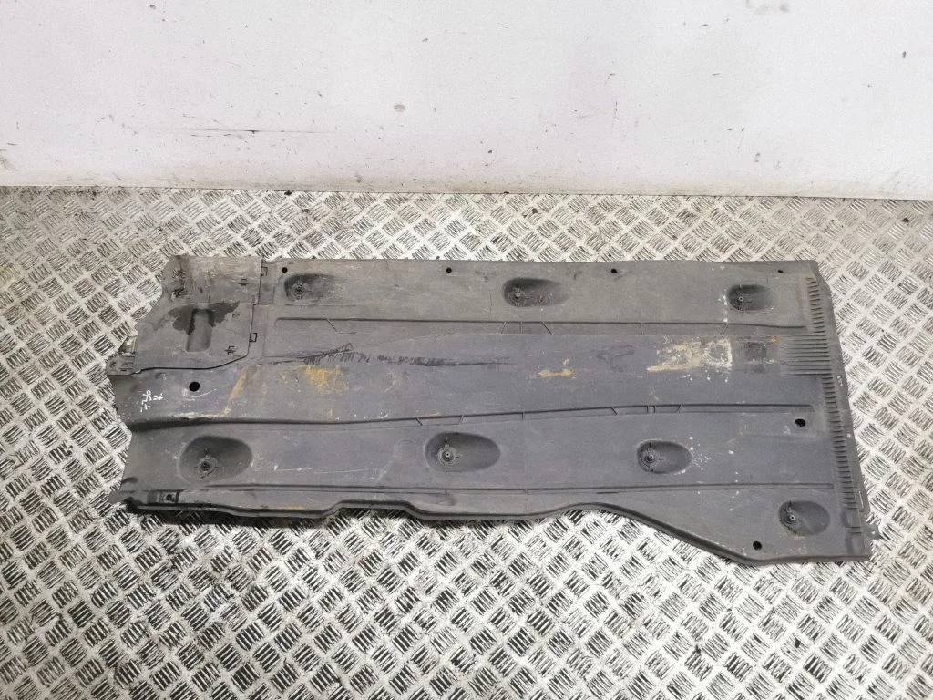 Center/middle under tray cover – left