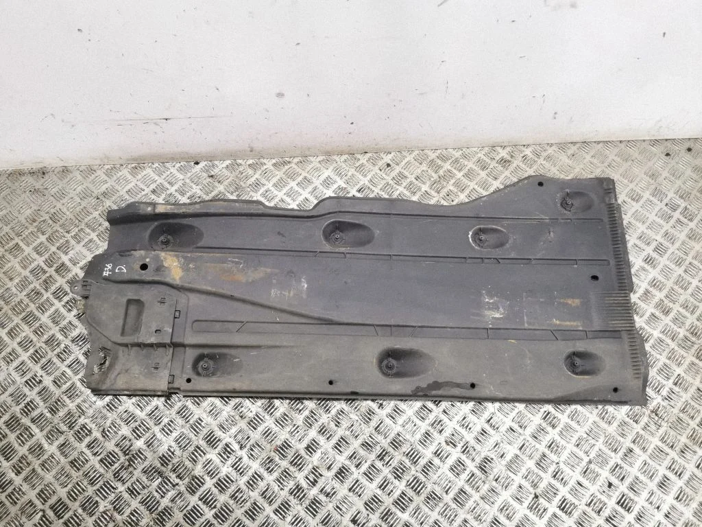 Center/middle under tray cover – right