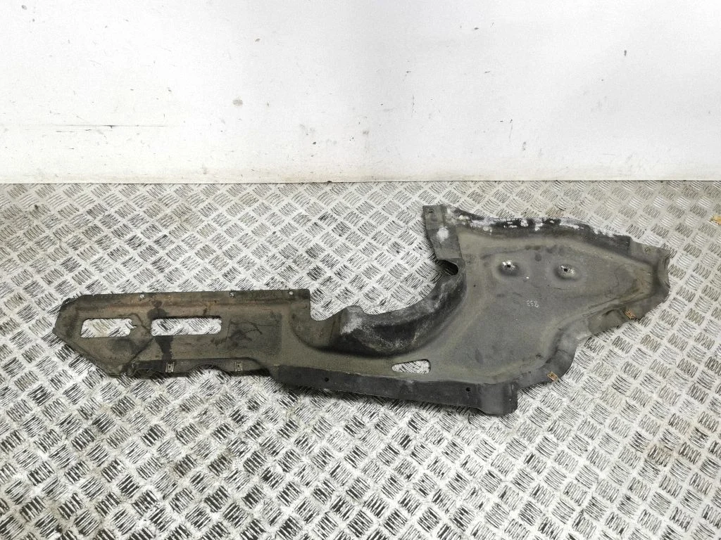 Center/middle under tray cover – left