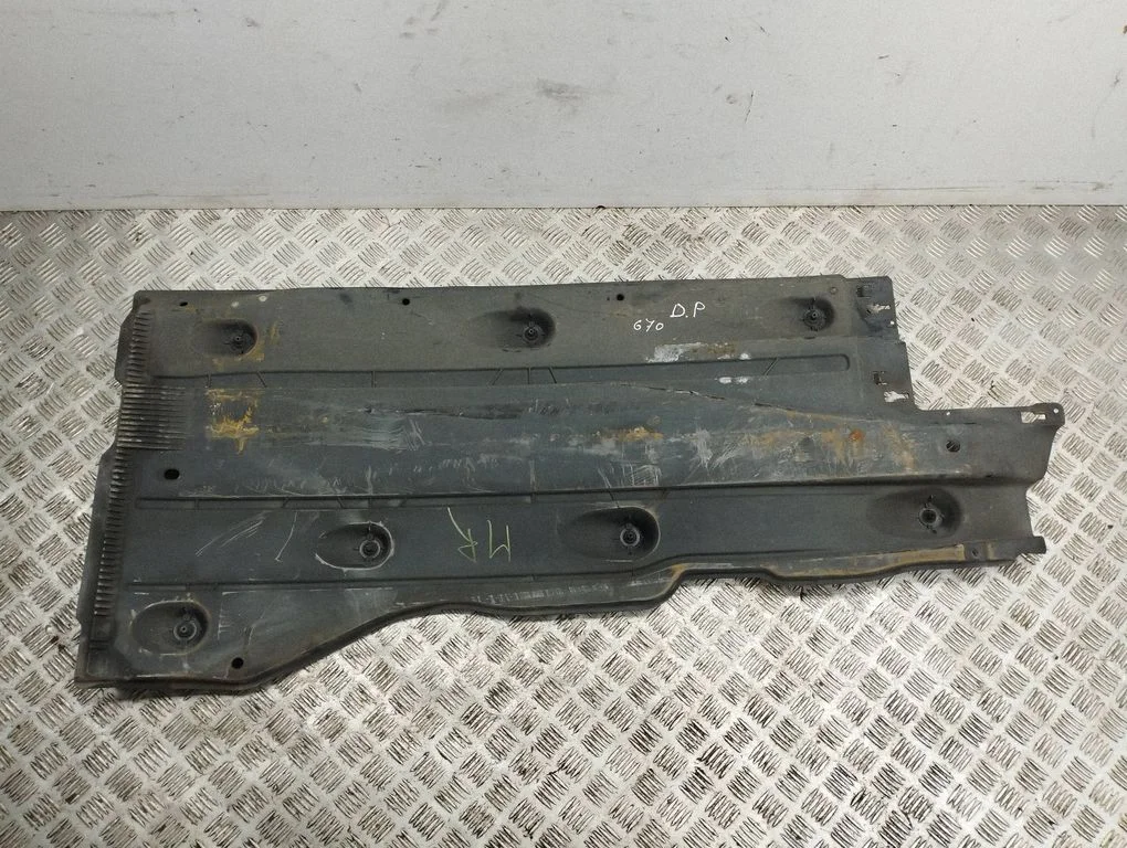Center/middle under tray cover – right