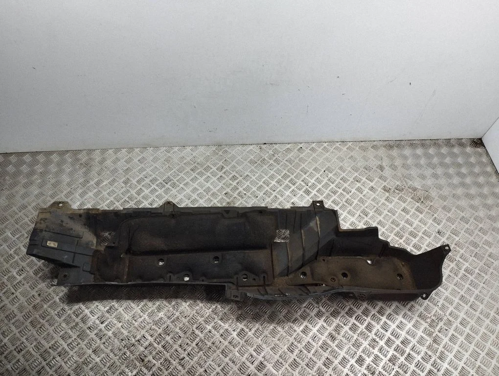 Center/middle under tray cover – right